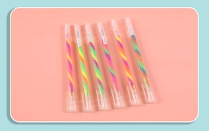 Set of 6 rainbow gel pens with clear barrels and colorful stripes on pink background
