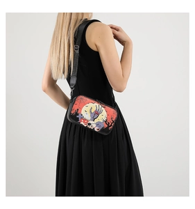Detail of crossbody bag with Halloween cemetery print and adjustable black shoulder strap