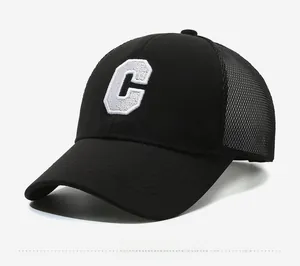 Detail of black baseball cap with embroidered letter C and breathable mesh back panel