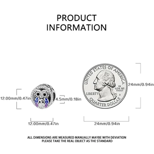 Silver owl charm with blue enamel and zircons shown next to a coin for size reference