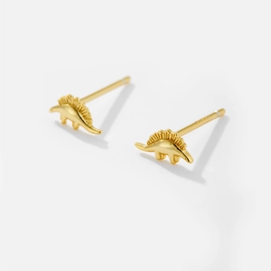 Macro detail of gold plated S925 sterling silver stegosaurus dinosaur stud earrings