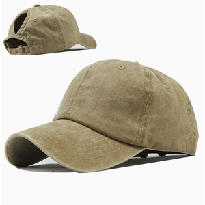 Detail view of cotton ponytail baseball cap with adjustable metal buckle and washed fabric texture