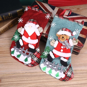 Christmas stocking gift bags featuring 3D Santa and Bear designs on burlap fabric