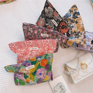 Flat lay of vintage floral makeup bags in five patterns with simple wish woven labels