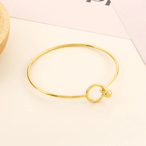 Minimalist gold stainless steel open bangle with unique sphere clasp design