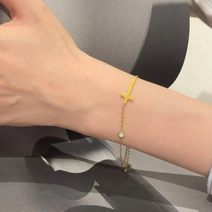 Gold-tone titanium steel cross necklace with round zircon on a minimalist thin chain