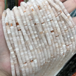 Close-up of pink and white natural stone tube beads for DIY jewelry making