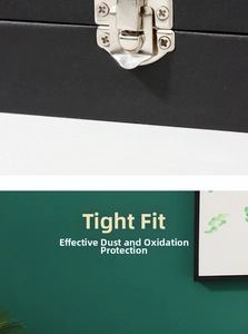 Detail of silver metal buckle on black leather badge box for dust-proof storage