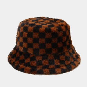 Detail shot of the checkerboard faux fur bucket hat showing plush texture and brown pattern