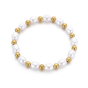 Elegante bracciale in oro 18 carati e perle d'acqua dolce barocche su sfondo bianco