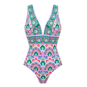 Close-up of vibrant floral mandala print on a V-neck one-piece swimsuit fabric