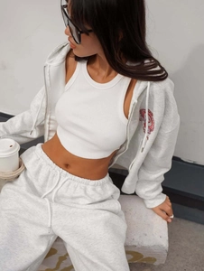 Three-piece light grey tracksuit with zip-up hoodie, jogger pants, and white crop top vest