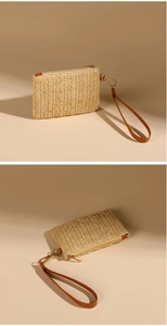 Detailed view of woven coin purse with brown leather wrist strap and metal zipper
