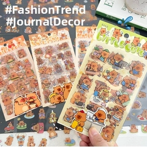 Close-up of cute cartoon bear and quokka stickers for stationery and journal decoration