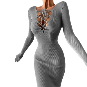 Detail view of the gray ribbed knit texture and lace-up neck design of the slim dress