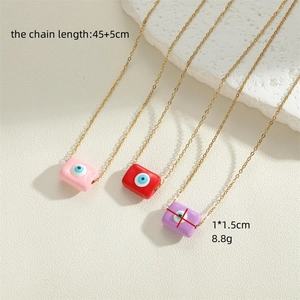 Three rectangle evil eye pendant necklaces in pink red and purple with golden chain link