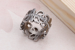 Detail of silver hollow leaf ring featuring a sparkling central row of cubic zirconia stones