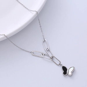 Silver butterfly necklace with black and white pendant on unique chunky link chain