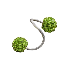 Macro shot of S-shaped spiral piercing with sparkling grass green disco ball studs