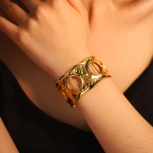 Elegant wide hammered gold cuff bracelet with hollow circular design for women