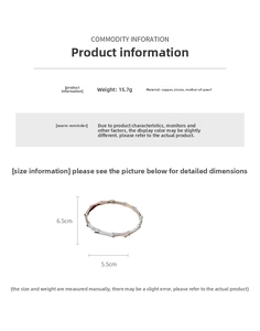Detail view of gold-plated bangle made of copper with zircon and mother of pearl