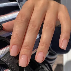 Classic short square press-on nails in natural nude pink with a high-gloss finish