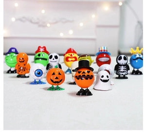 Close-up of collection including pumpkin, skull, and ghost wind-up toys for Halloween