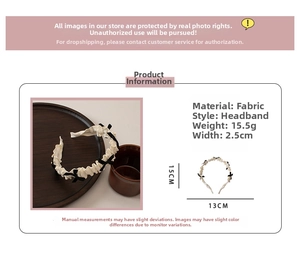 Detailed view of cream ruffled bow headband with fabric texture and size dimensions