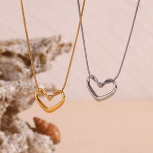 Minimalist heart pendant necklaces in gold and silver finish with sleek snake chain style