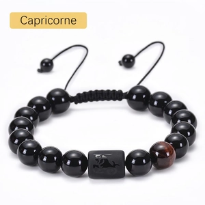 Detailed view of Capricorn beaded bracelet with black onyx, tiger eye and adjustable cord