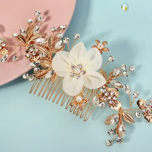 Elegant gold bridal hair comb with white fabric flowers, pearls and sparkling crystals