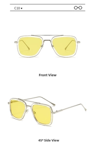 Detail of square sunglasses with light yellow lenses and silver metal frame in macro view