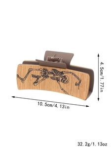 Detailed size view of skeleton pattern hair claw clip, 10.5cm length and 32.2g weight
