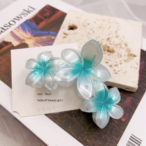 Three gradient blue and white flower hair clips on a card, measuring 10cm each