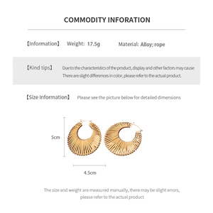 Detailed view of large gold braided earrings with alloy rope texture and size specs