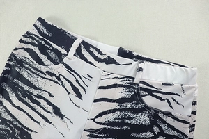 Detail of zebra print pants waist with double belt loops and high-quality stitching