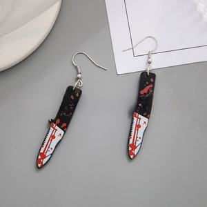Macro detail of blood-splattered dagger acrylic earrings for Halloween costume accessory