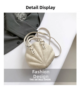 Detail of cream lace shell bag with dual handles and adjustable shoulder strap