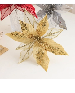 Detail of gold glitter sequin poinsettia flower for Christmas tree and wreath decoration
