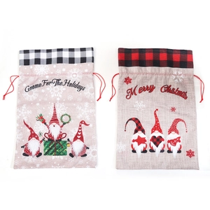 Large burlap Christmas gift bag featuring Gnome motifs and festive plaid drawstring top