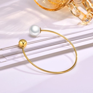 Adjustable gold stainless steel cuff bracelet with white pearl and polished metallic bead