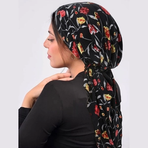 Floral print headscarf in black with red and yellow patterns shown on a side-view model