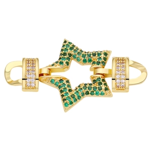 Detailed view of a gold hexagonal star jewelry connector with green and clear gemstones