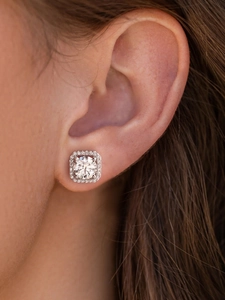 Macro shot of 925 sterling silver moissanite stud earrings featuring square halo design
