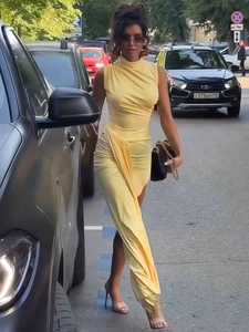 Sleeveless yellow maxi dress with elegant ruching and side slits for a stylish summer look