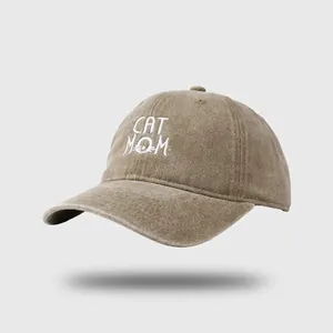 Vintage washed denim baseball cap in khaki with embroidered Cat Mom text and cat face design