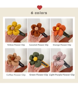 Detailed grid of six plush flower hair claws in yellow, orange, and purple shades