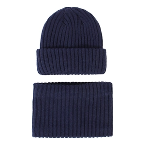 Detail of navy blue ribbed knit hat and scarf set showcasing thick woven texture