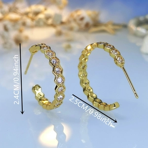 Detail view of 18K gold plated honeycomb hoop earrings with zircon stones and size markers