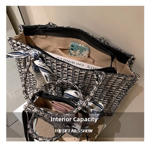 Detail showing spacious interior of black and white tweed tote bag with silk scarf